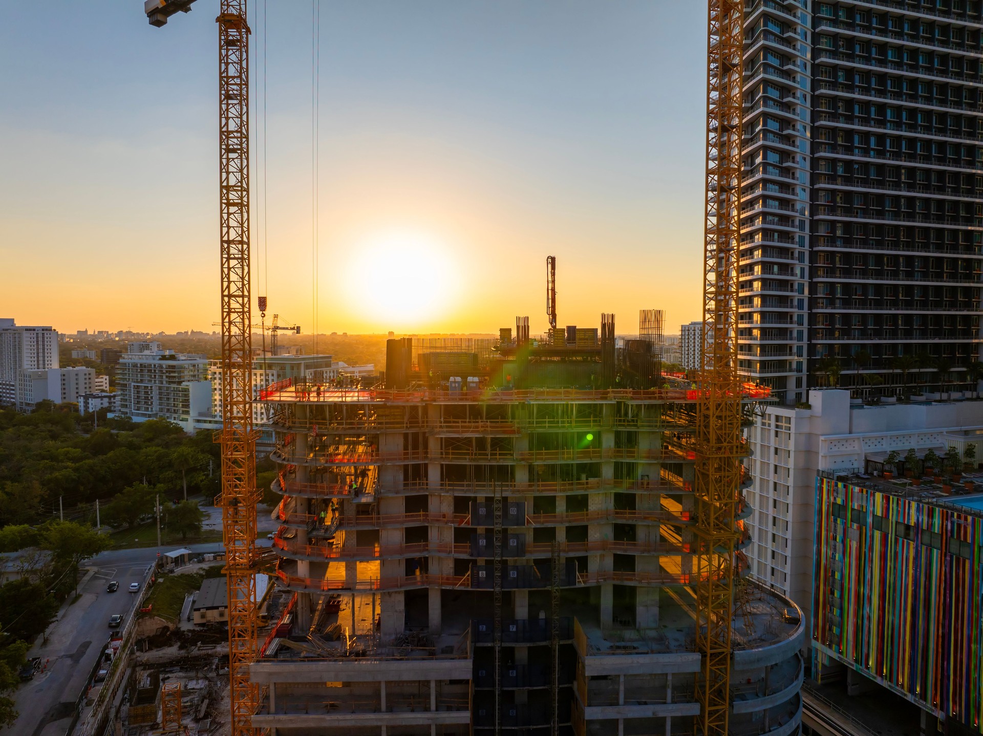 Miami, Florida. Developing American megapolis with new high-rise buildings under construction at sunset